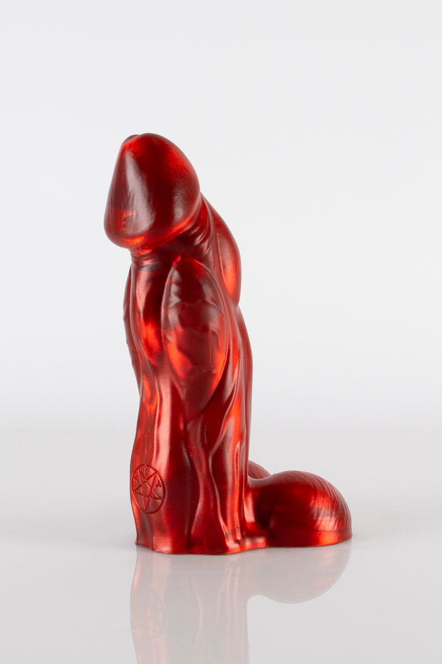 A side photo of a red bull dildo by Twisted Beast.