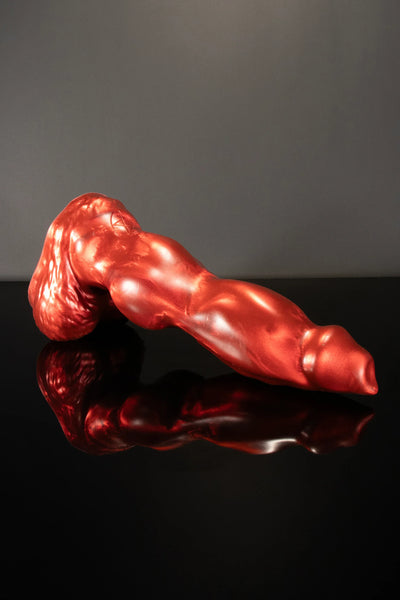 A product photo of a red dog dildo.