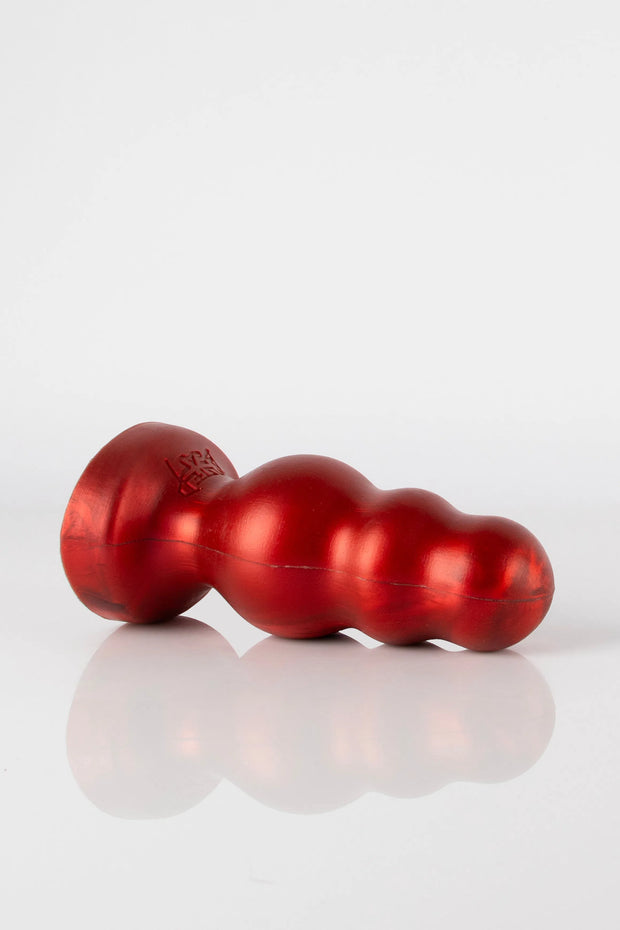 A product photo shot of a red bubble butt plug laid down.