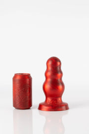 A size comparison photo of a medium red bubble butt plug. 