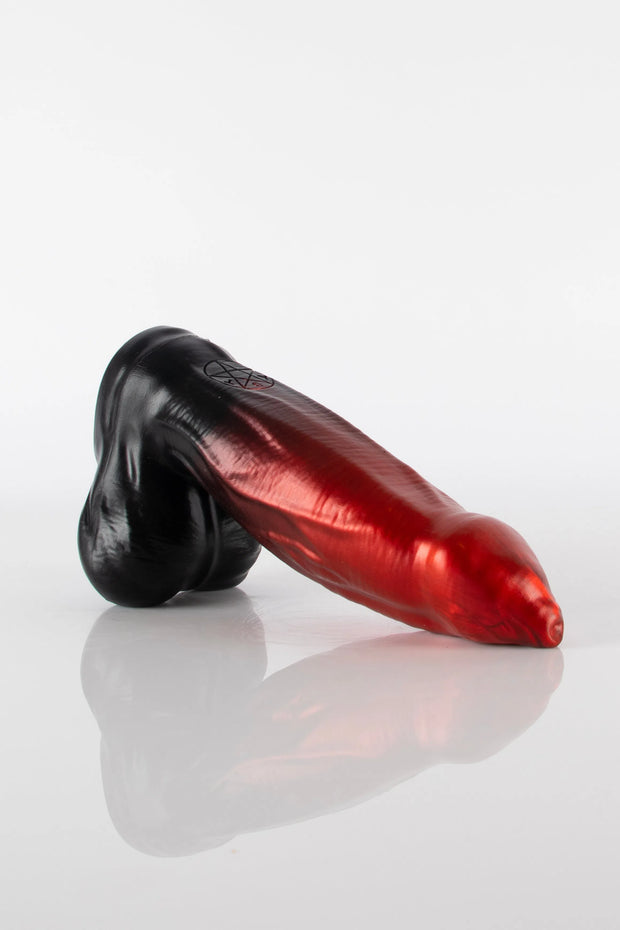 A product photo of a red ombre to black demon dildo by Twisted Beast.