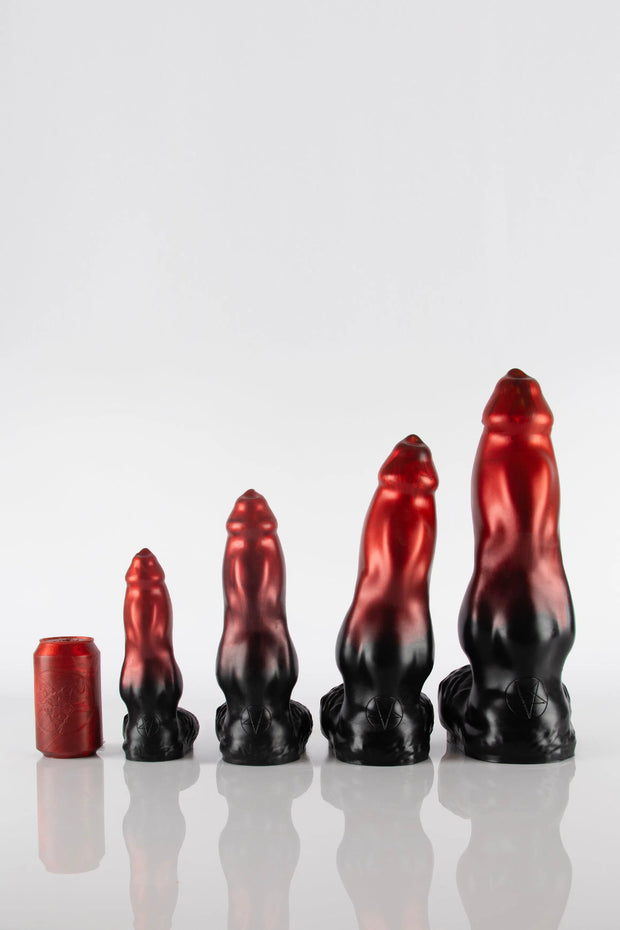 A size comparison shot of 4 dog dildos next to a can.