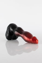 A product photo of a dog dildo lying down.