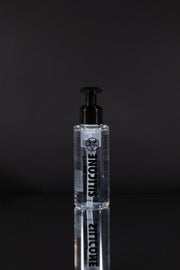 A product photo of a 100ml bottle of silicone lube.