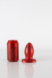 A 6.5 inch red silicone butt plug.