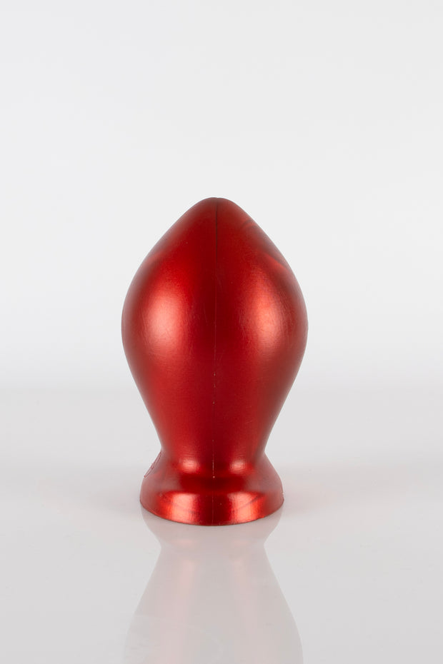 A side photo of a silicone butt plug.