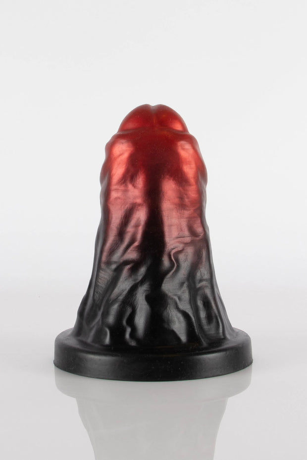 A product photo of a black and red XXL dildo taken from the back.