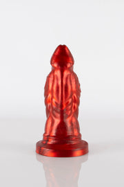 A product photo of a red reptile dildo showing off the pentagram logo of Twisted Beast.